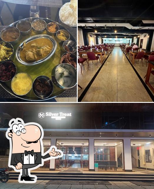 Take a look at the image depicting interior and food at Silver Treat Restaurant