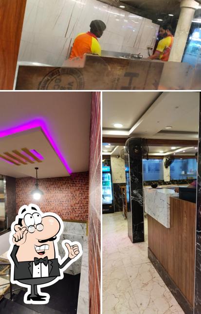 Take a look at the image showing interior and food at Chennai Rawther Restaurant