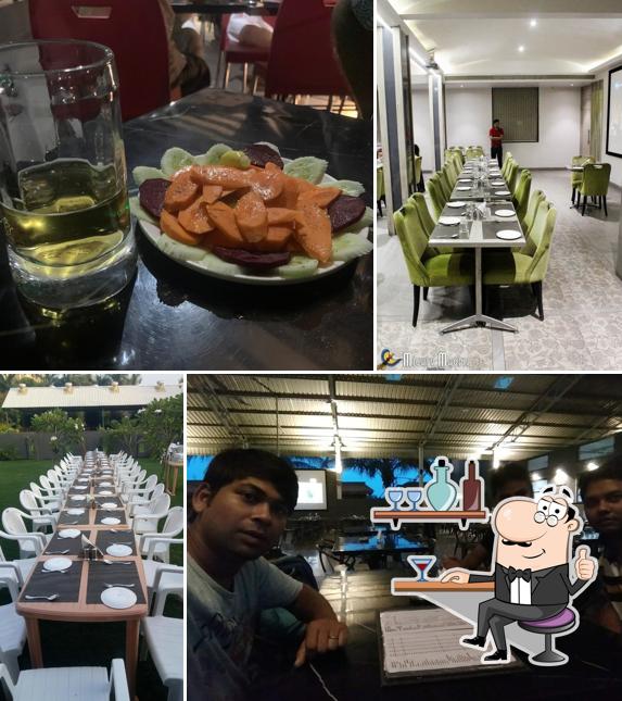 Take a seat at one of the tables at Moonlight Bar & Restaurant