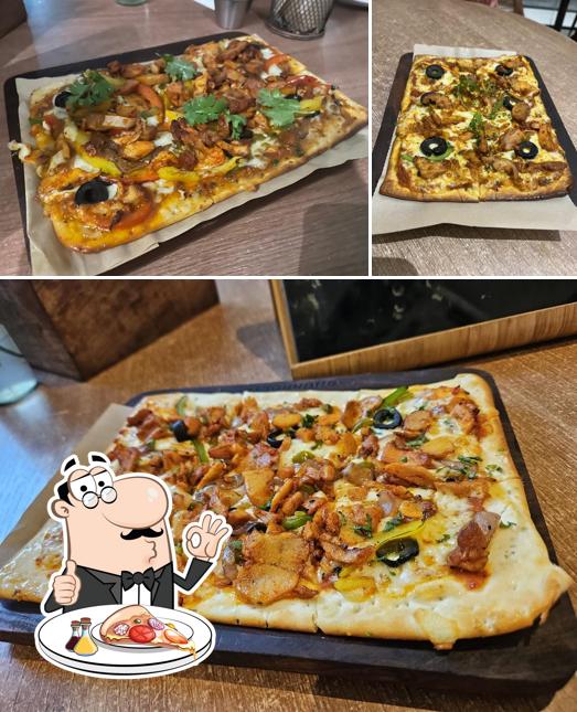 Try out pizza at Churrolto Banjara Hills