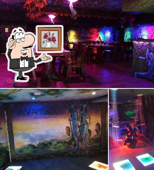 Take a seat at one of the tables at Yazhee World Restaurant