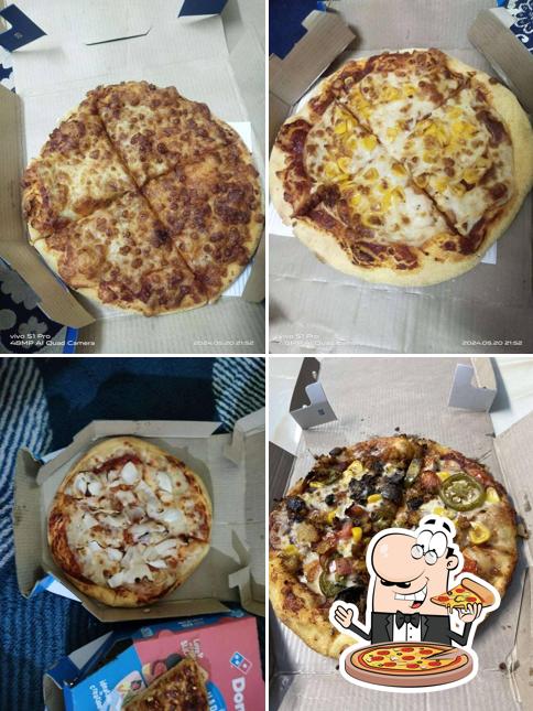 Try out pizza at Domino's Pizza