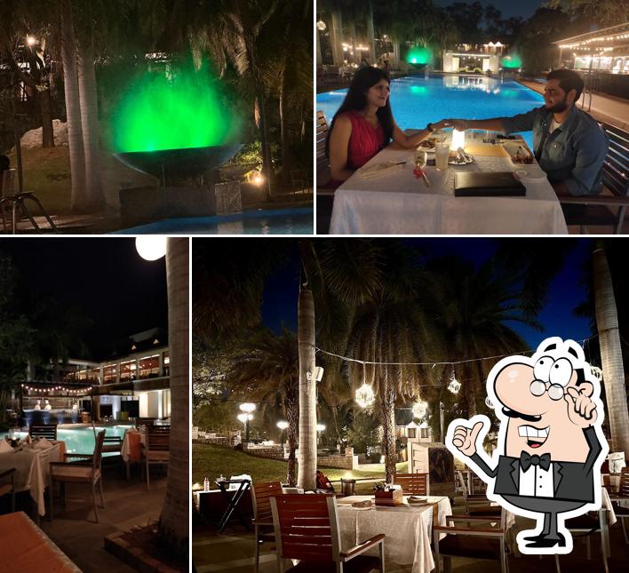 Take a seat at one of the tables at Mist The Poolside Kitchen
