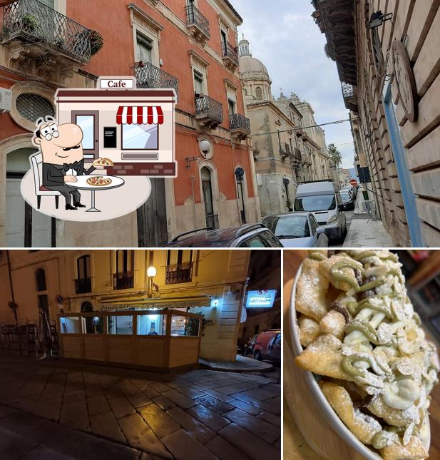 Questa è la immagine che raffigura la esterno e cibo di Pizzeria Del Corso