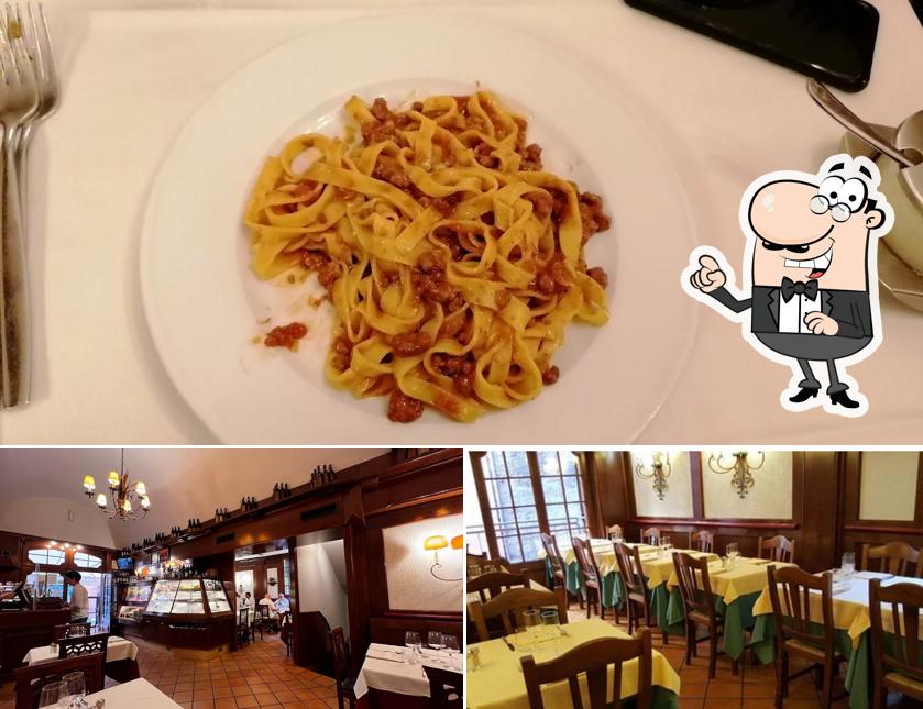 Questa è la immagine che presenta la interni e cibo di Trattoria Leonida