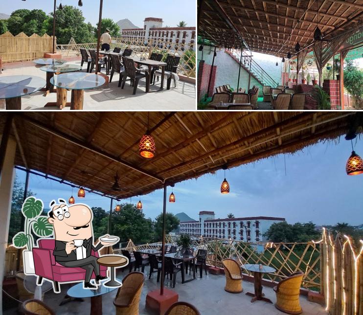 Take a seat at one of the tables at Amigo Mango Garden restaurant