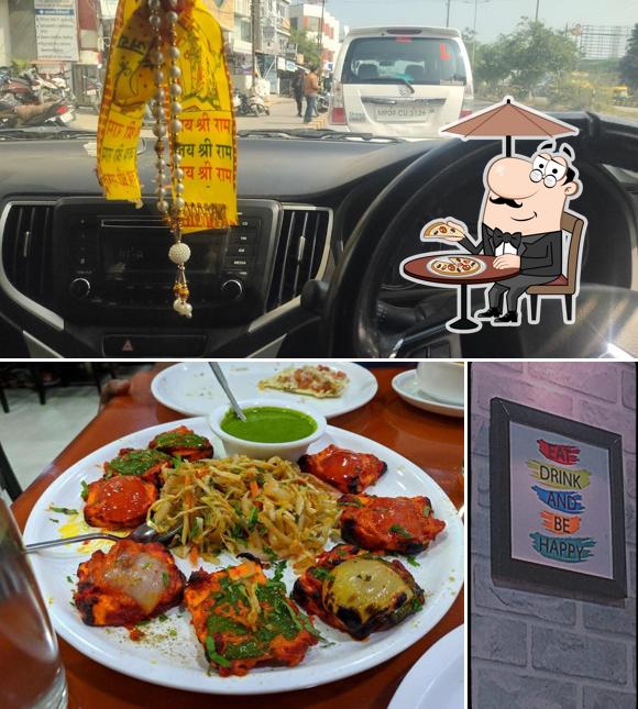 The picture of exterior and dining table at Ridhi Sidhi restaurant