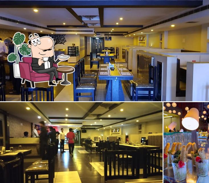 Take a seat at one of the tables at Hotel Delicia