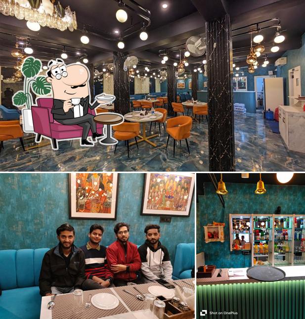 Take a seat at one of the tables at Sanjha Bela Restaurant