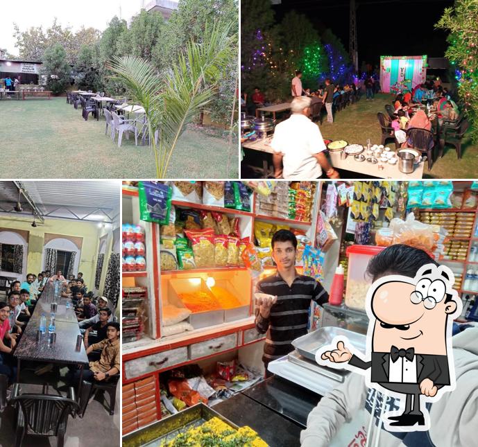 Take a seat at one of the tables at Hotel Yuvraj