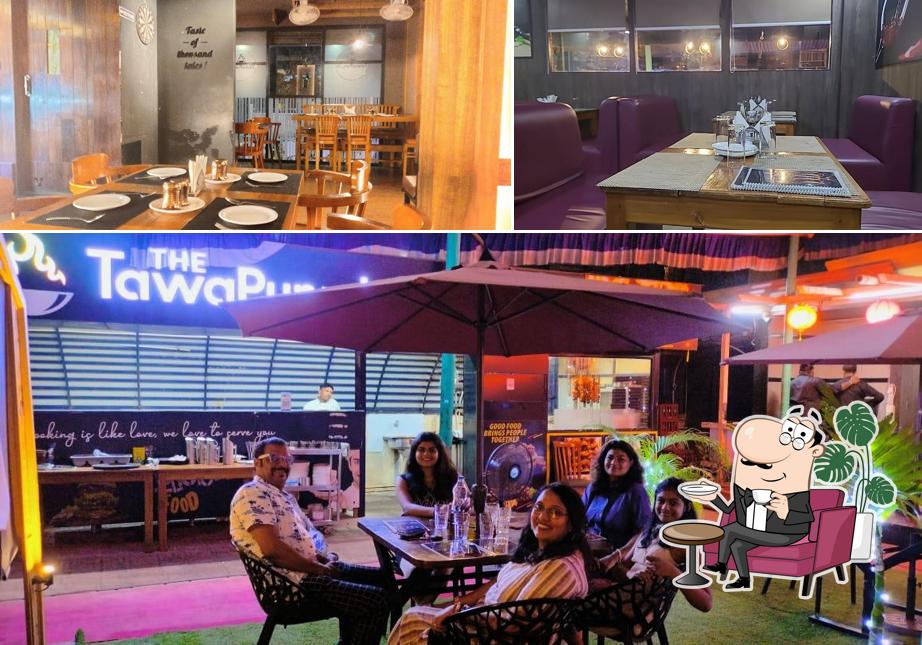 Take a seat at one of the tables at The Tawa Punjab