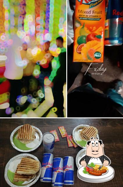Check out the picture depicting food and interior at Royal Cafe