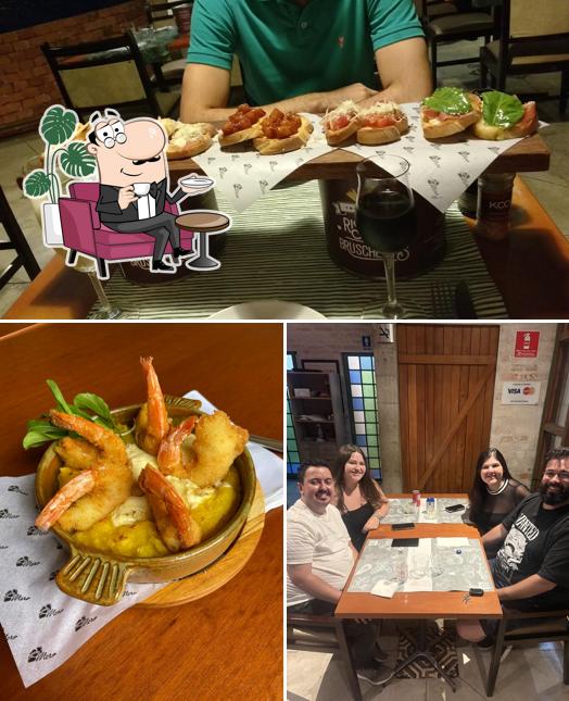 Sente em uma das mesas no Mero Restaurante