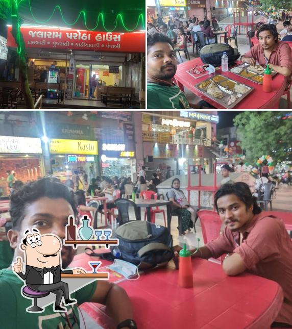 Take a seat at one of the tables at Jalaram parotha house (Townhall Wala)
