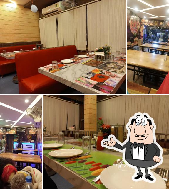 Take a seat at one of the tables at Panthashala Restaurant