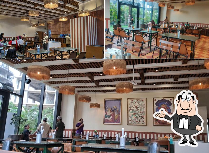 Take a seat at one of the tables at Carnatic Cafe