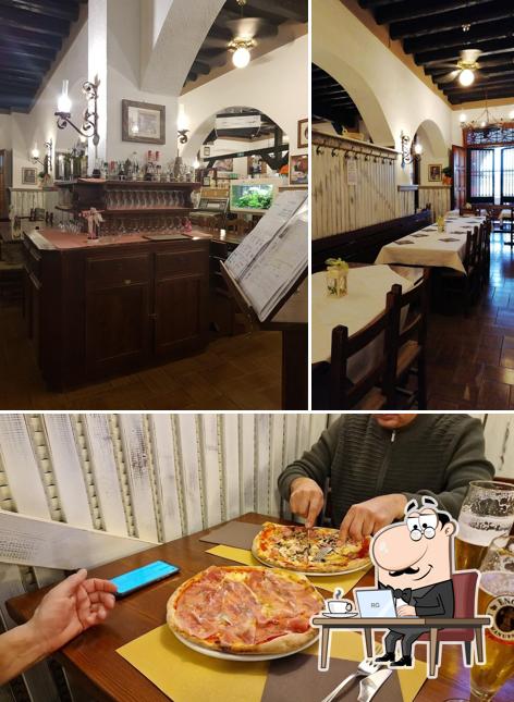 Questa è la foto che mostra la interni e pizza di Dogana Vecchia - Hotel & Residence B&B Ristorante & Pizzeria
