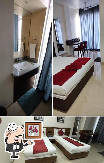 Take a seat at one of the tables at Hotel Pushpanjali