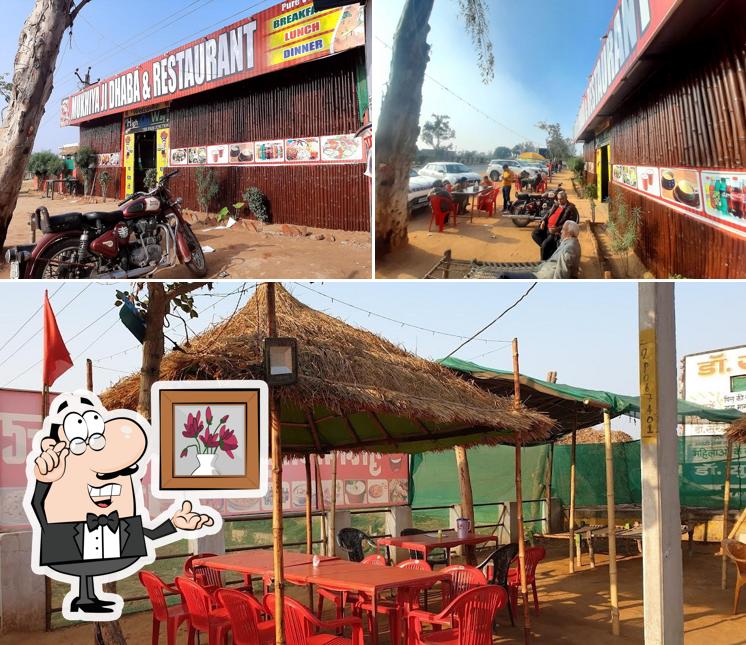 Take a seat at one of the tables at MUKHIYA JI DHABA & restorant and UP TAX