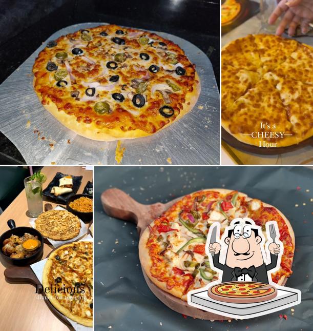 Try out pizza at THE GARLIC KNOT PIZZA & CAFE ADAJAN SURAT