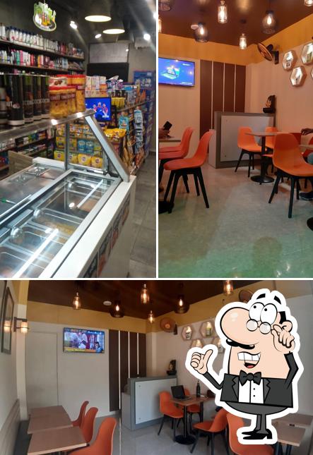 Take a seat at one of the tables at Baton Cafe