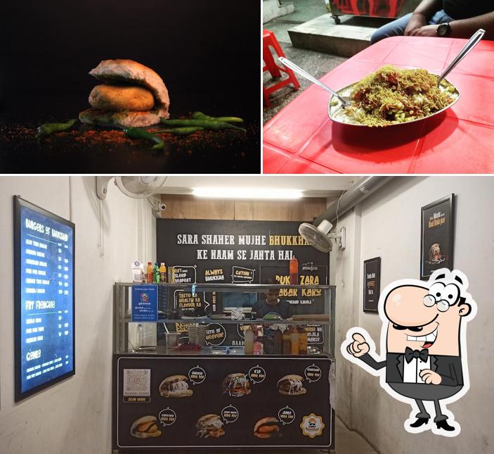 This is the image showing interior and food at Bhukkhad Vadapav