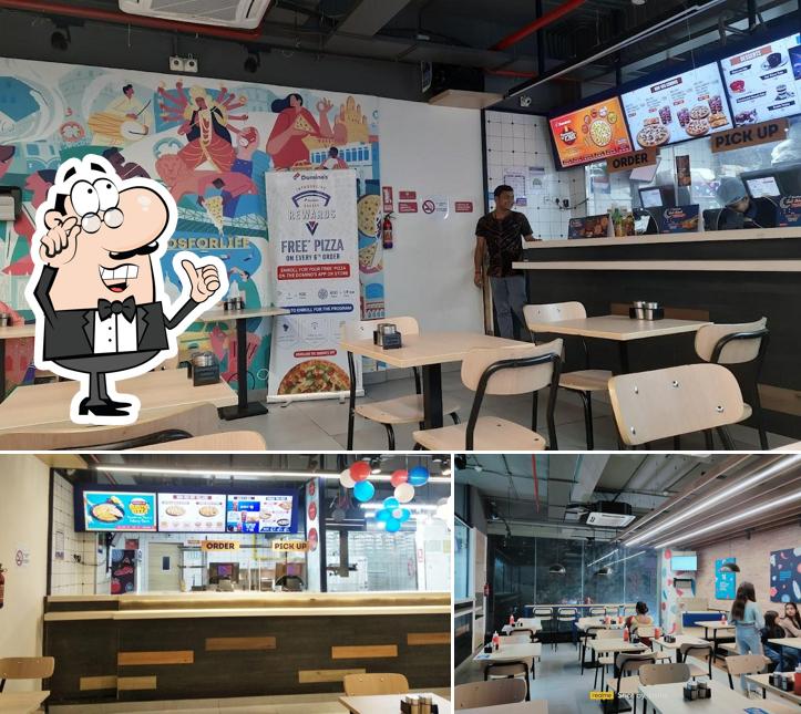 Take a seat at one of the tables at Domino's Pizza Benachity, Durgapur Take a seat at one of the tables at Domino's Pizza Benachity, Durgapur