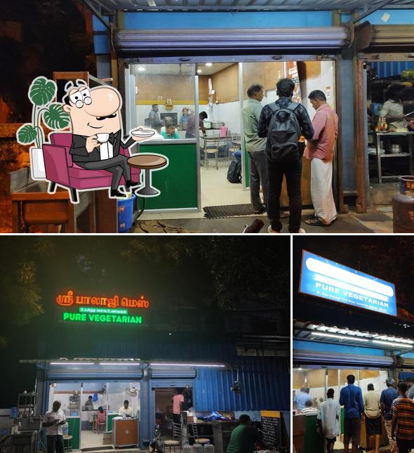 Take a seat at one of the tables at Balaji mess pure vegetarian