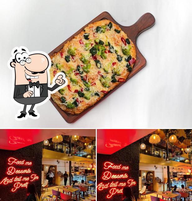 This is the photo depicting interior and food at Piazza by Little Italy