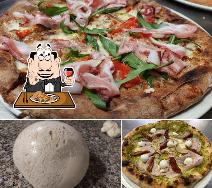 A Pizzeria Il Quadrifoglio, puoi prenderti una bella pizza