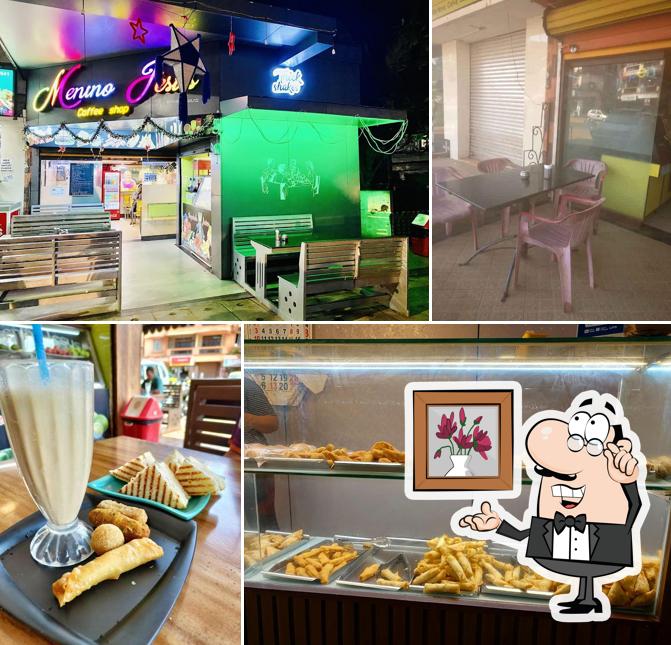 Take a seat at one of the tables at Menino Jesus Coffee Shop