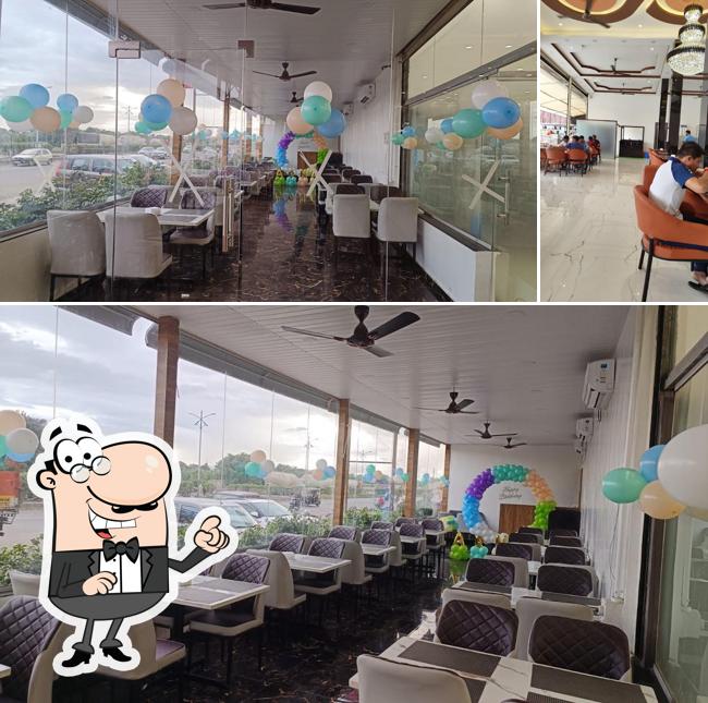Take a seat at one of the tables at Bharati Veg Restaurant