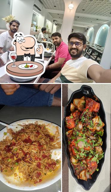 Check out the picture displaying food and interior at AANGAN RESTRO
