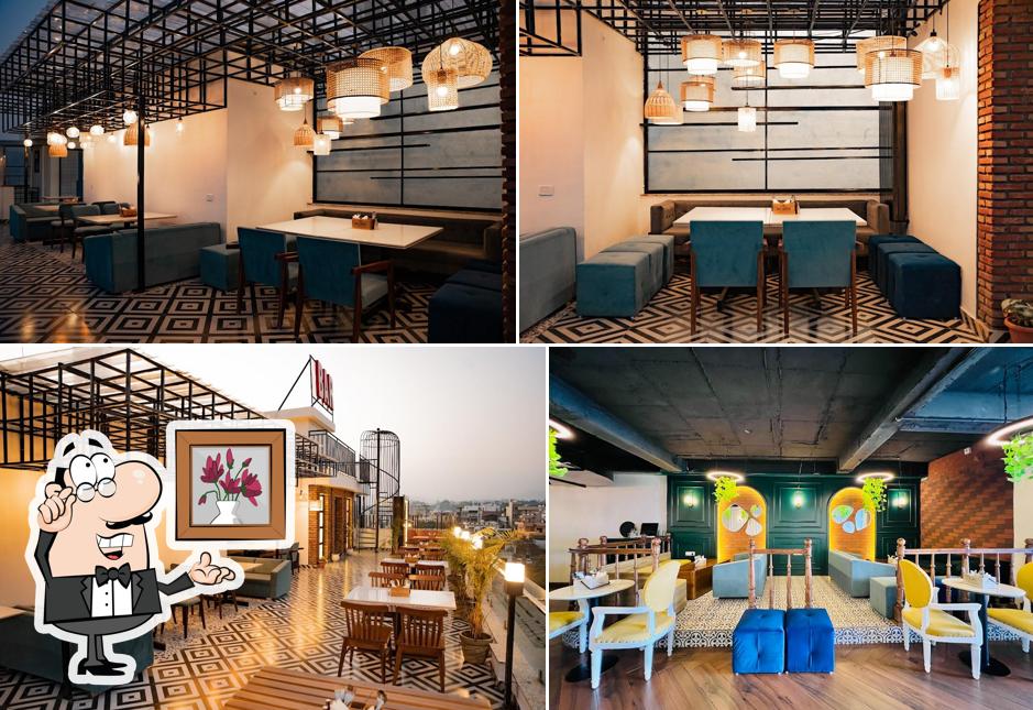 Take a seat at one of the tables at Ek Aur Bar