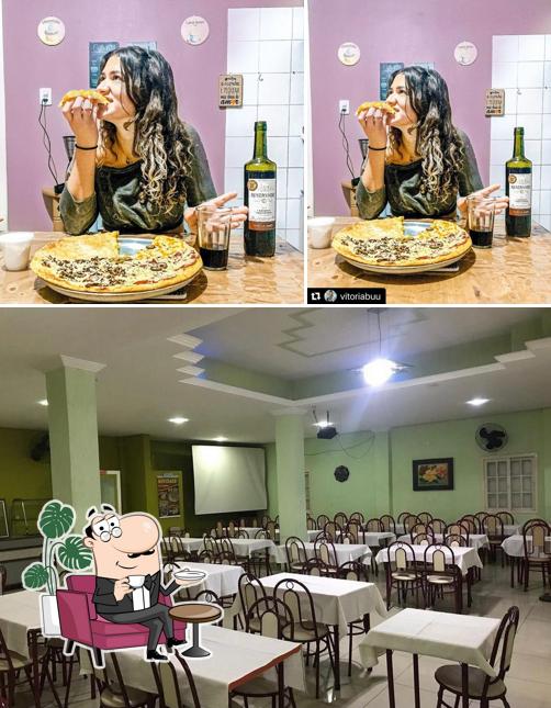 O interior do Pizzaria e Lancheria Luiziana