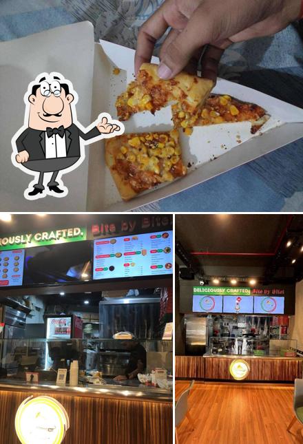 The picture of interior and food at Taranovas Pizza