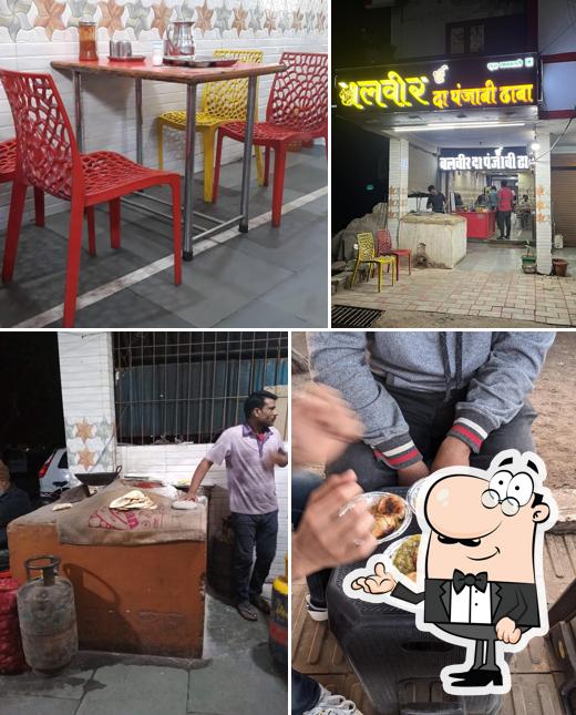 Take a seat at one of the tables at Balveer Da Punjabi Dhabha