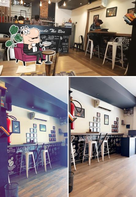 Take a seat at one of the tables at Cafe Karma