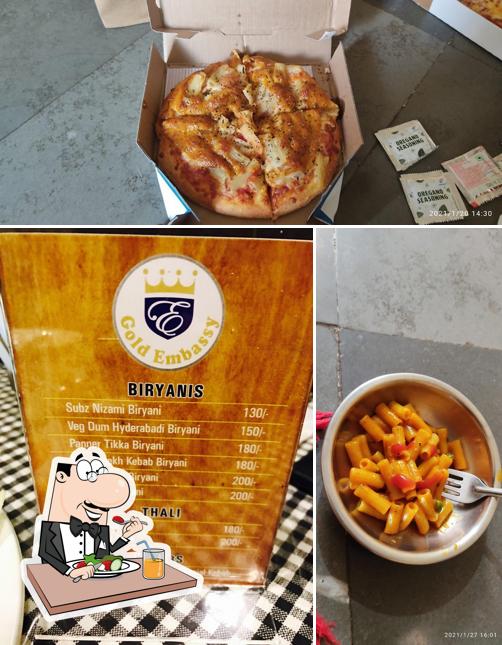 This is the image showing food and beer at Gold Embassy