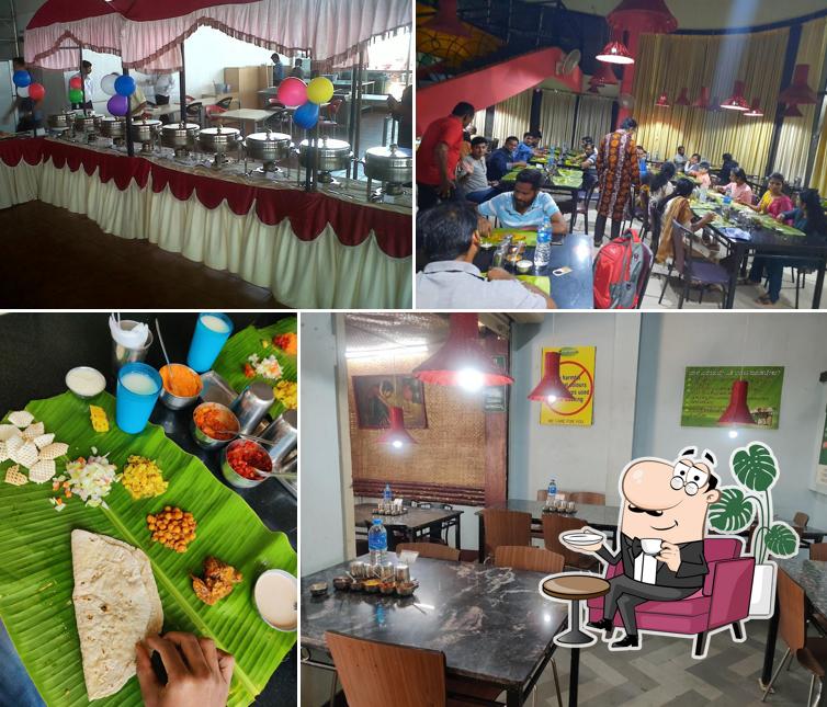 Take a seat at one of the tables at Annapurneshwari Thali Restaurant, Ayodhyanagar