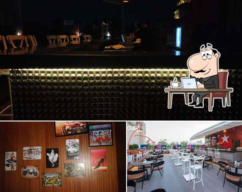 Take a seat at one of the tables at Cuba Libre