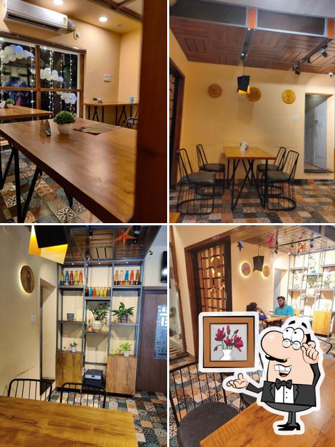 Take a seat at one of the tables at Waffee House Trivandrum