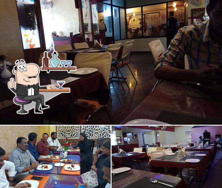 Take a seat at one of the tables at Daawath Restaurant Top Rated