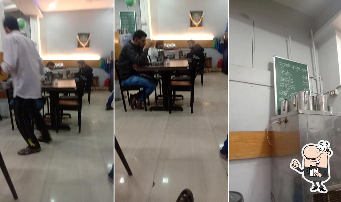 Take a seat at one of the tables at Maharashtrian Bhojanalay