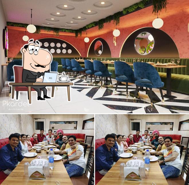 Take a seat at one of the tables at Deep Sweets And Restaurant