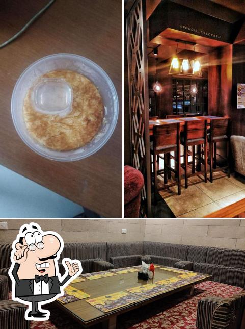 Take a seat at one of the tables at Zam Zam Restaurants YMR