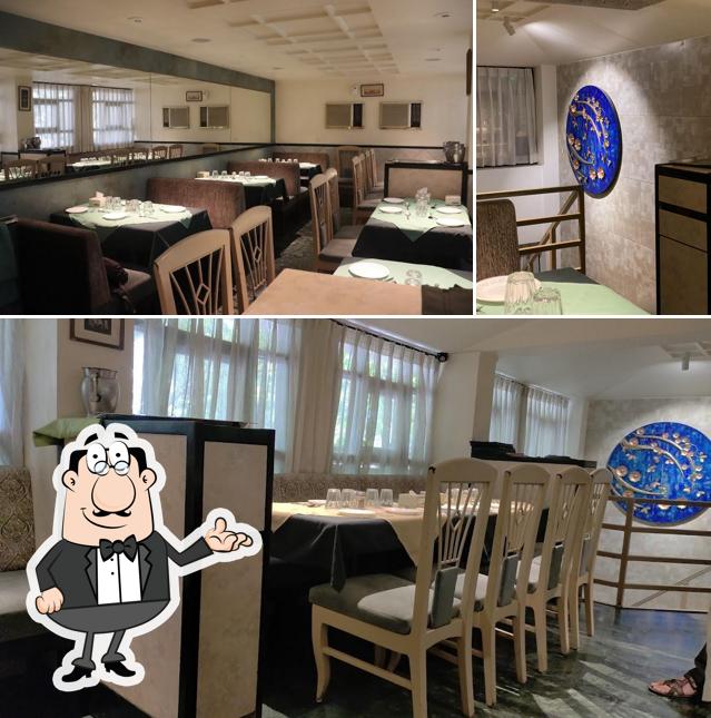 Take a seat at one of the tables at Shraavan Restaurant