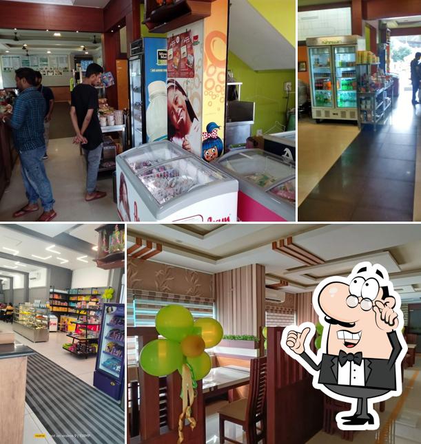 Take a seat at one of the tables at Hotel Maheswari Vegetarian