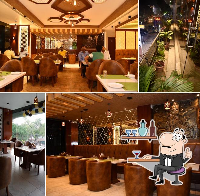 Take a seat at one of the tables at Kohinoor Restaurant Gorakhpur