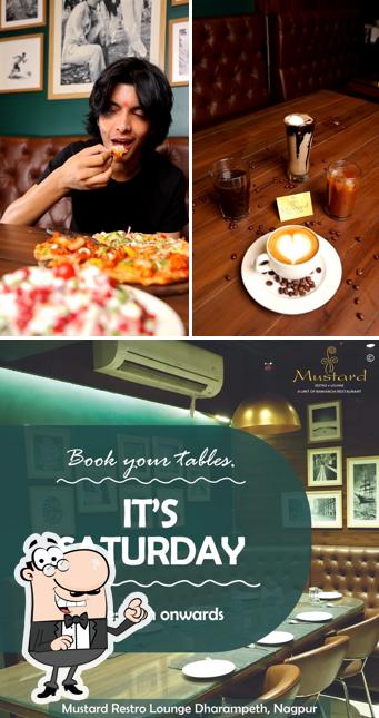 Take a seat at one of the tables at Mustard